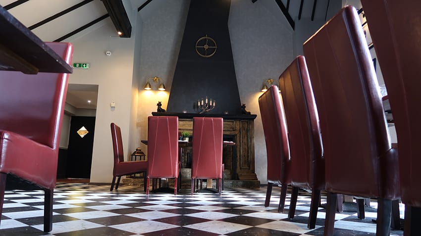 Awesome Afternoon Tea At The Chesterton Hotel, Bicester: Review 3 The checkerboard black and white flooring and the impressive chimney breast leading up to the beamed ceiling at the Chesterton Hotel