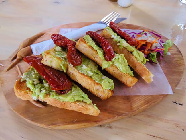 7 Of The Best Places To Eat In Maun 3 Smashed Avocado on Sourdough with Sun-Dried Peppers and salad and Tshilli's Hot Pepper Sauce