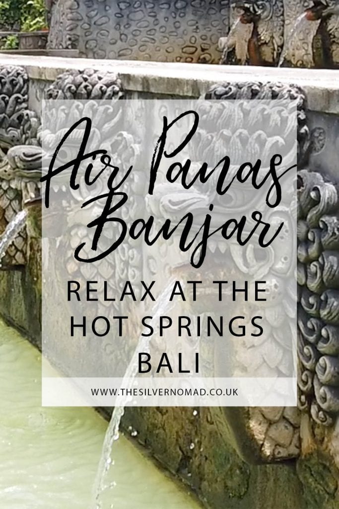 Air Panas Banjar relax at the Hot Springs Bali with stone-carved nagas (mythical dragons) spouting sulphur water