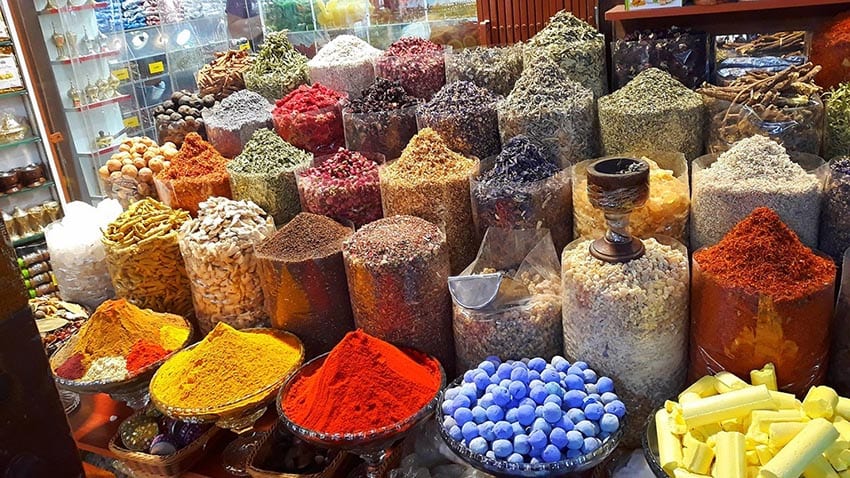 A Week In Dubai Itinerary - Best Things To Do In Dubai In 7 Days 14 Jars and dishes of different spice with yellow, gold and red at the front, a must on your 7 day Dubai Itinerary