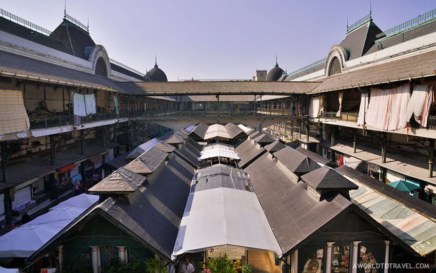 23 Amazing Unesco Sites In Europe, Off The Beaten Track 6 Porto Market showing the roof tops of the booths with blue sky behind