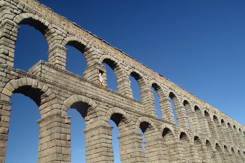 23 Amazing UNESCO Sites in Europe, Off the Beaten Track 22 The double arches of the Segovia Aqueduct taken against a blue sky