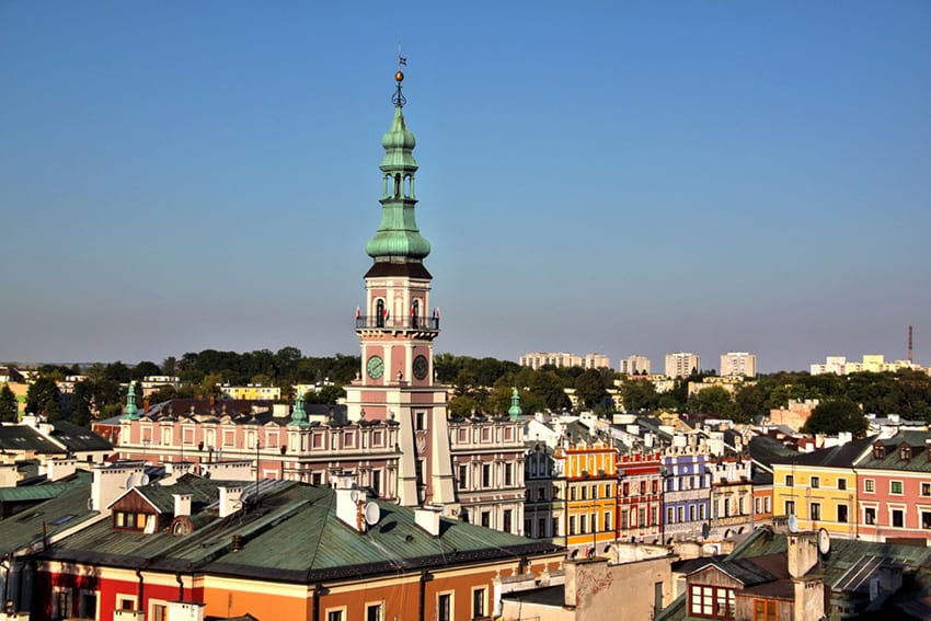 23 Amazing UNESCO Sites in Europe, Off the Beaten Track 9 Old town in Zamosc showing roofs of buildings and spire of a church