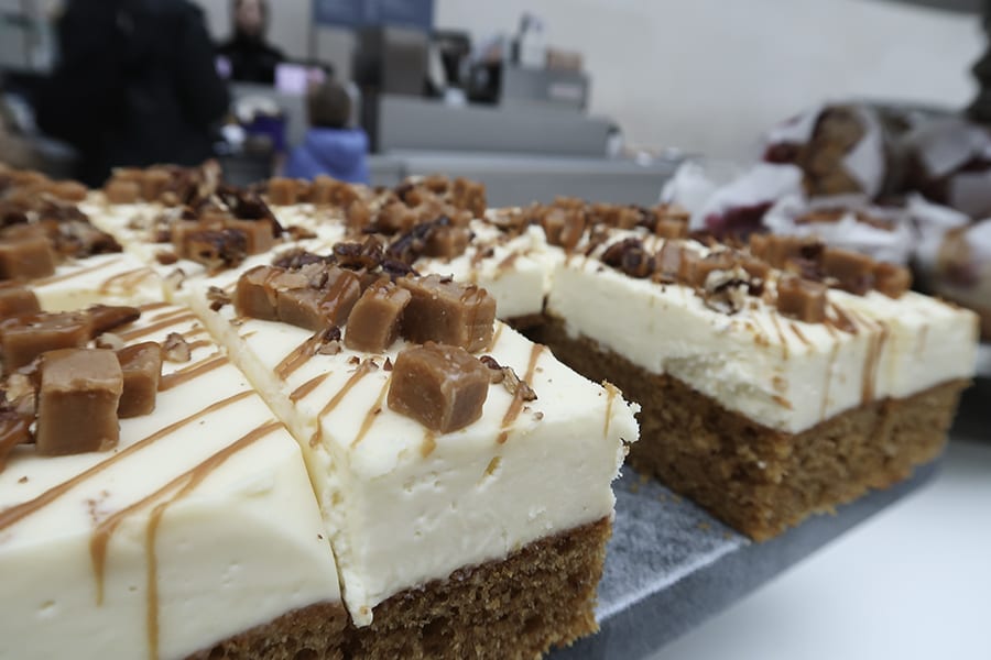 rectangles of sponge cake topped with thick frosting and cubes of caramel and toffee syrup available from one of the cafes at the British Museum