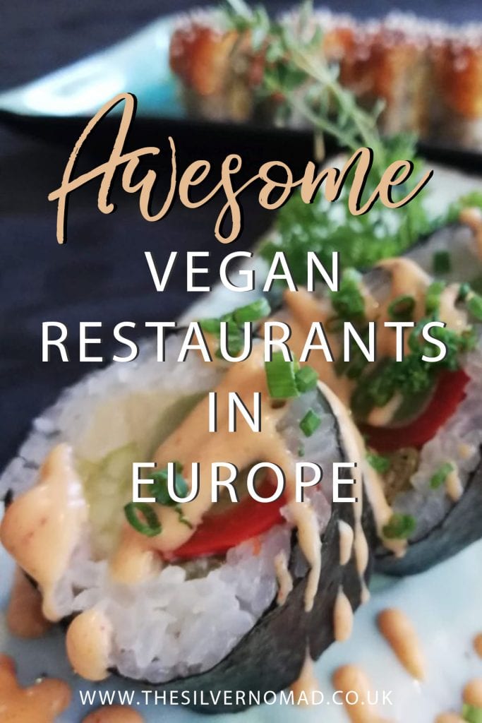 Amazing Vegan Restaurants In Europe 14 Vegan sushi in black nori sheets with white rice and red pepper and green avocado with a peach coloured dressing. Writing "Awesome vegan restaurants in Europe" superimposed on top