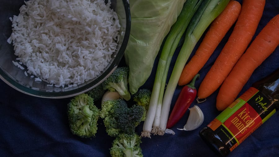 Easy how to make Nasi Goreng, Indonesia's favourite rice dish 4 The raw ingredients for Nasi Goreng - a dish of cold white rice, cabbage, spring onions, carots, chilli, garlic, brocolli and kichap manis