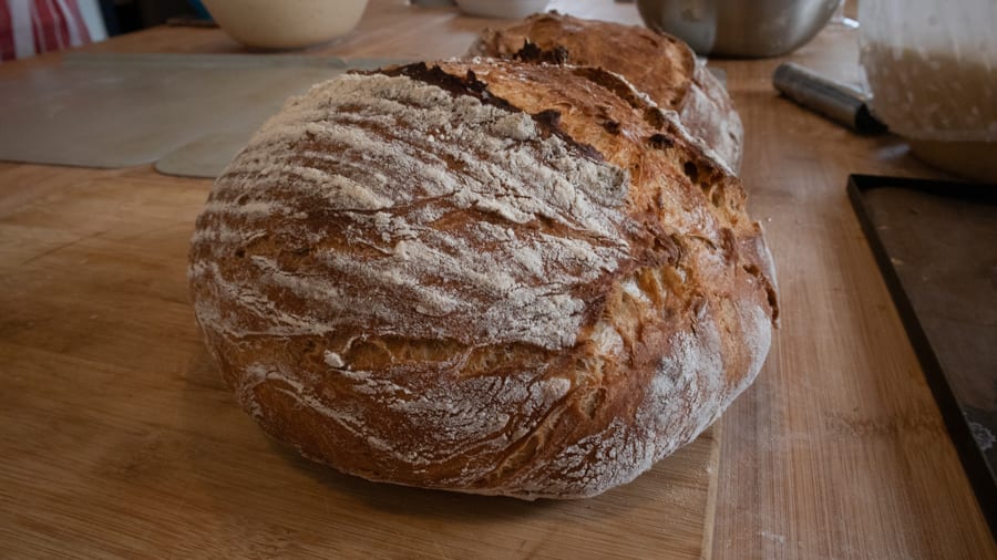 Artisan Bread Baking at the Abergavenny Baker 10 round loaf of bread with crisp edges and powdered with flour
