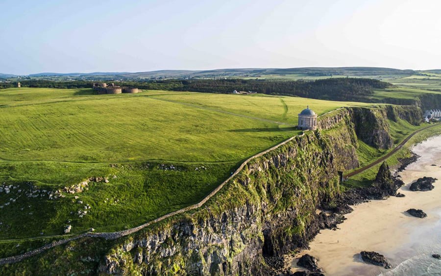 grass covered cliffs with Mussenden Temple on the edge