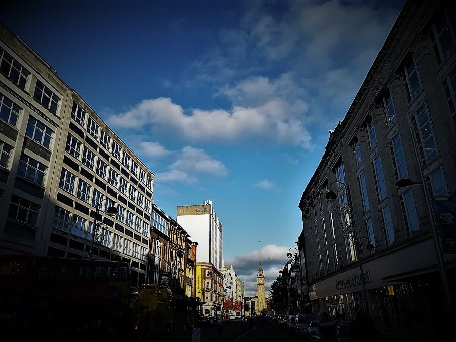View of buildings tapering off into the distance and blue skies
