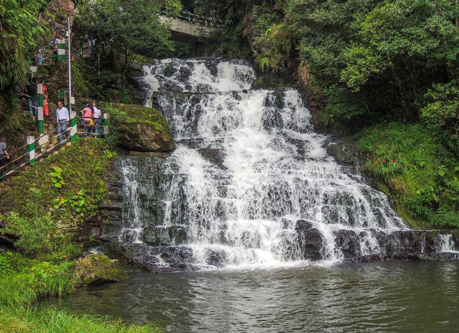 25 Amazing Destinations For Winter Sun Around The World 7 Multi-tiered waterfall with pool at the bottom. People walking down the steps to the left