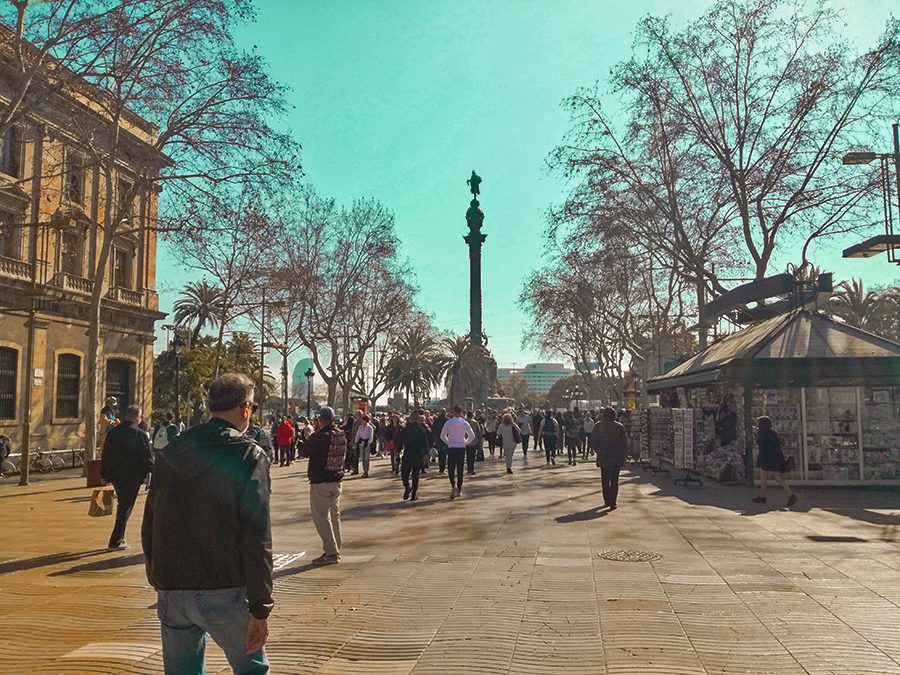 25 Amazing Destinations For Winter Sun Around The World 25 people walking in the Ramblas in Barcelona in the winter sun