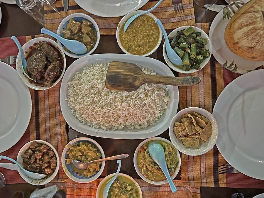The Best Food In Sri Lanka To Eat (Including 5 Easy Recipes!) 2 What to eat in Sri Lanka - The staple food in Sri Lanka curry - a selection of curries surrounding a large bowl of rice