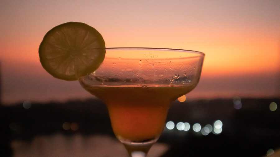 The Best Food In Sri Lanka To Eat (Including 5 Easy Recipes!) 14 Jetwing Jaffna arrack cocktail against a sunset sky