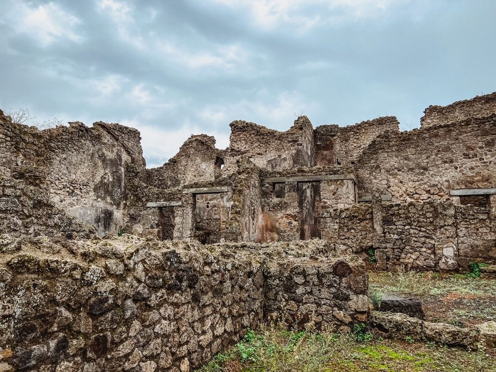 Stunning UNESCO Sites in Italy to discover in 2023 11 Archaeological ruins of Pompeii showing walls, doorways and windows