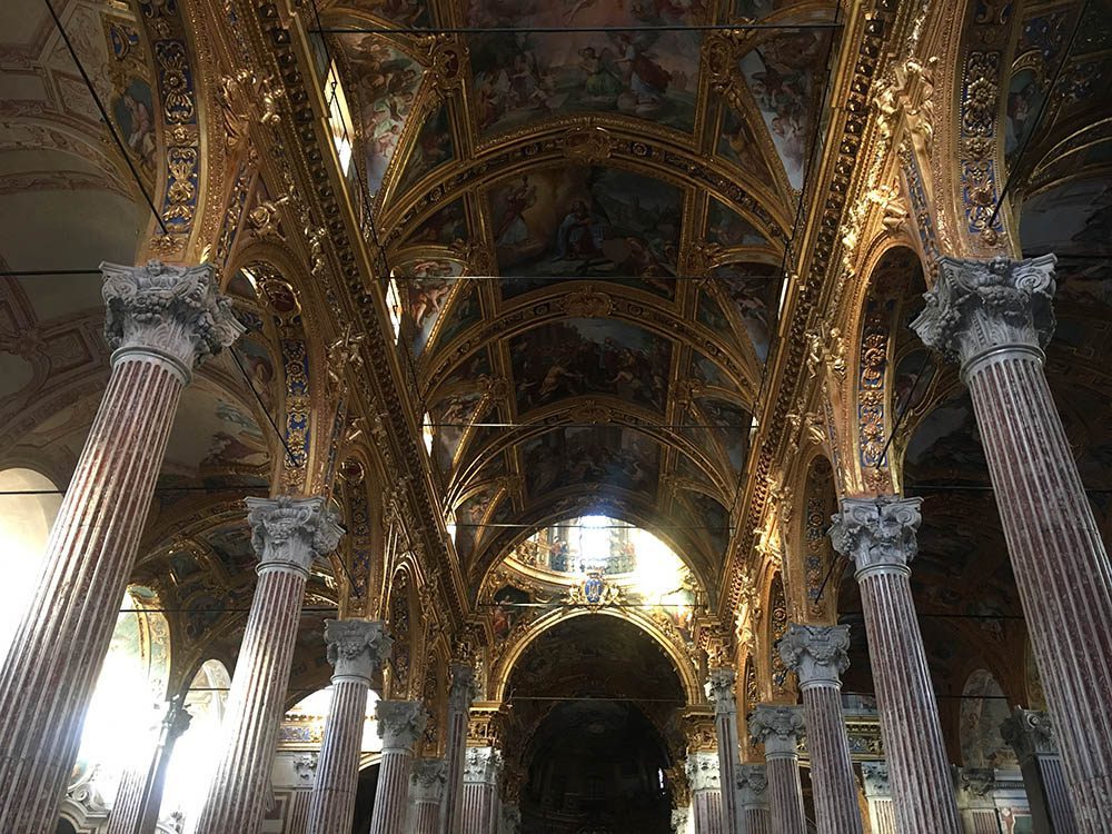 Stunning UNESCO Sites in Italy to discover in 2023 21 The golden arched ceiling at the Rolli Pallace atop the round columns