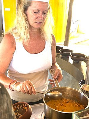 The Best Food In Sri Lanka To Eat (Including 5 Easy Recipes!) 25 Larch stirring the dhal curry on the stove