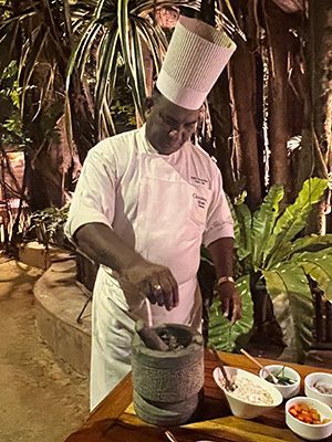 The Best Food In Sri Lanka To Eat (Including 5 Easy Recipes!) 29 chef in whites adding spices to the sambol mix