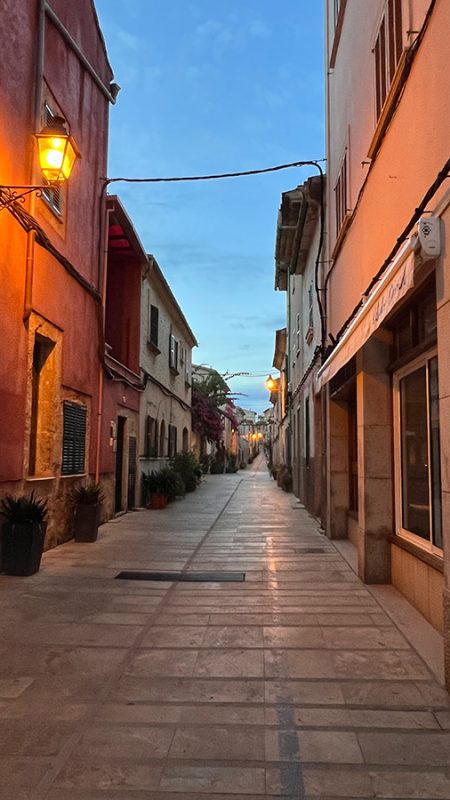 27 Of The Best Things To Do In Alcudia, Mallorca (2023) 3 street in Alcudia Old Town at Dusk