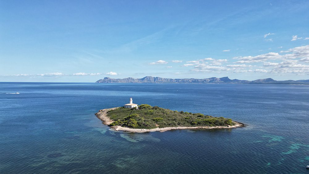 27 Of The Best Things To Do In Alcudia, Mallorca (2023) 13 Formentor lighthouse on an island surrounded by sea