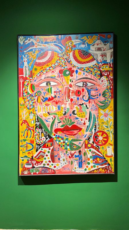 27 Of The Best Things To Do In Alcudia, Mallorca (2023) 10 One of the colourful images in Sa Bassa Blanca Museum on a vivid green wall