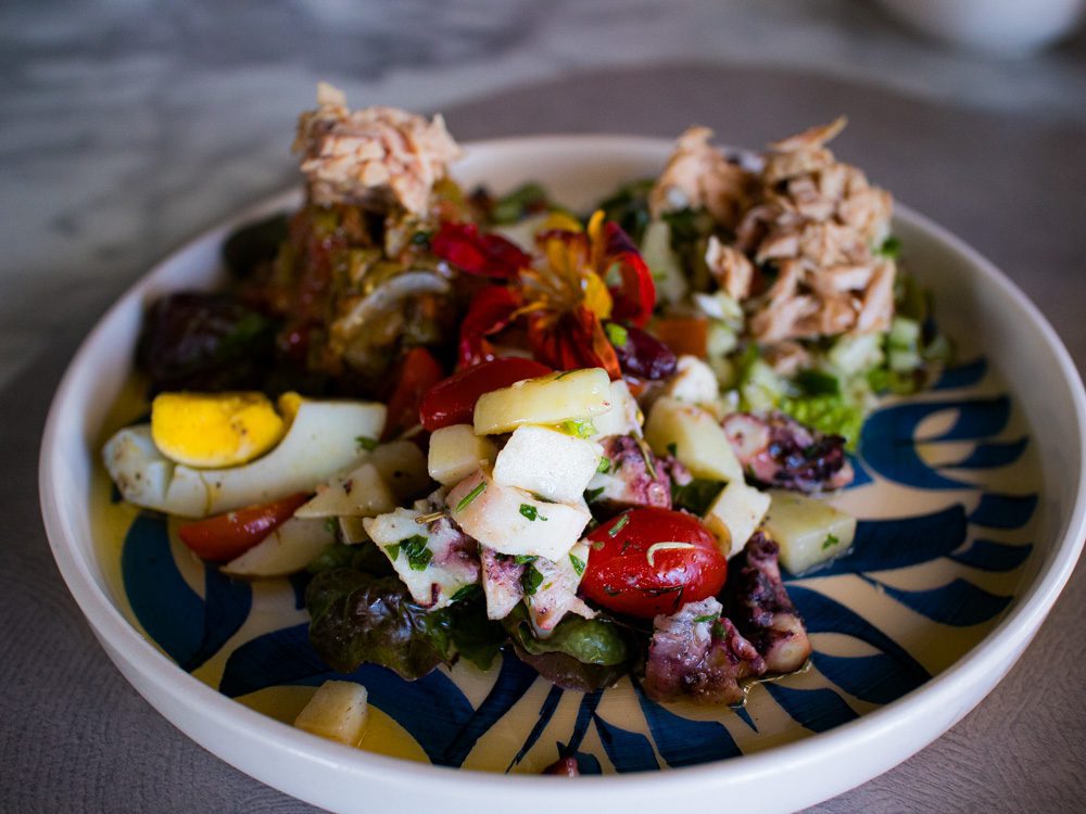 Sawa Taste of Tunisia: Explore the amazing food of Tunisia (2024) 54 Blue and white plate with salads including eggs, tuna, octopus