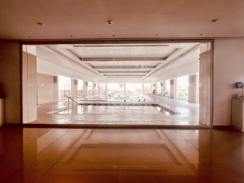 The Elegant Vip Suites At The Royal Thalassa Monastir (2024) 10 a large glass wall with a pool in it