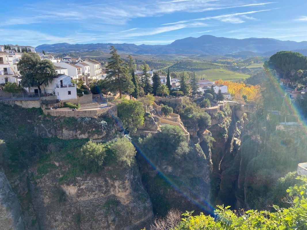 Is Andalucia Worth Visiting? 7 Amazing Reasons to Visit in 2025 9 Ronda in Andalcuia on a cliff wht hills and fields beyond