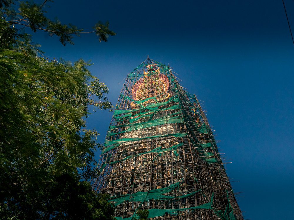 Meenakshi Amman Temple in Madurai. Brightly coloured golpuram with scaffolding over it as it is repainted