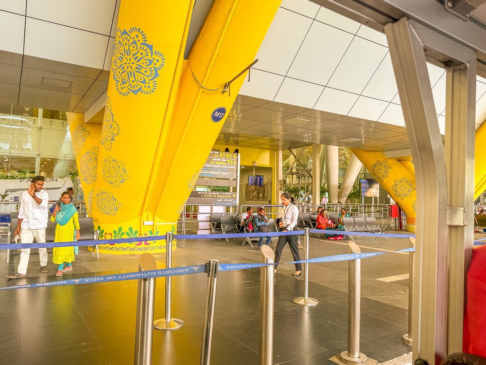 Chennai Airport with yellow pillars covered with painted decorations