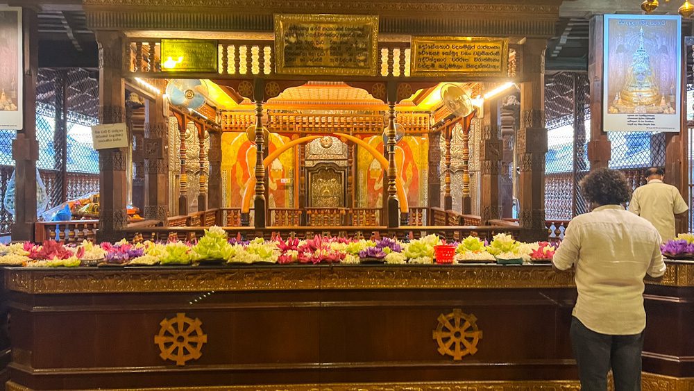 Waiting for the Sacred Tooth Ceremony in front of the offerings