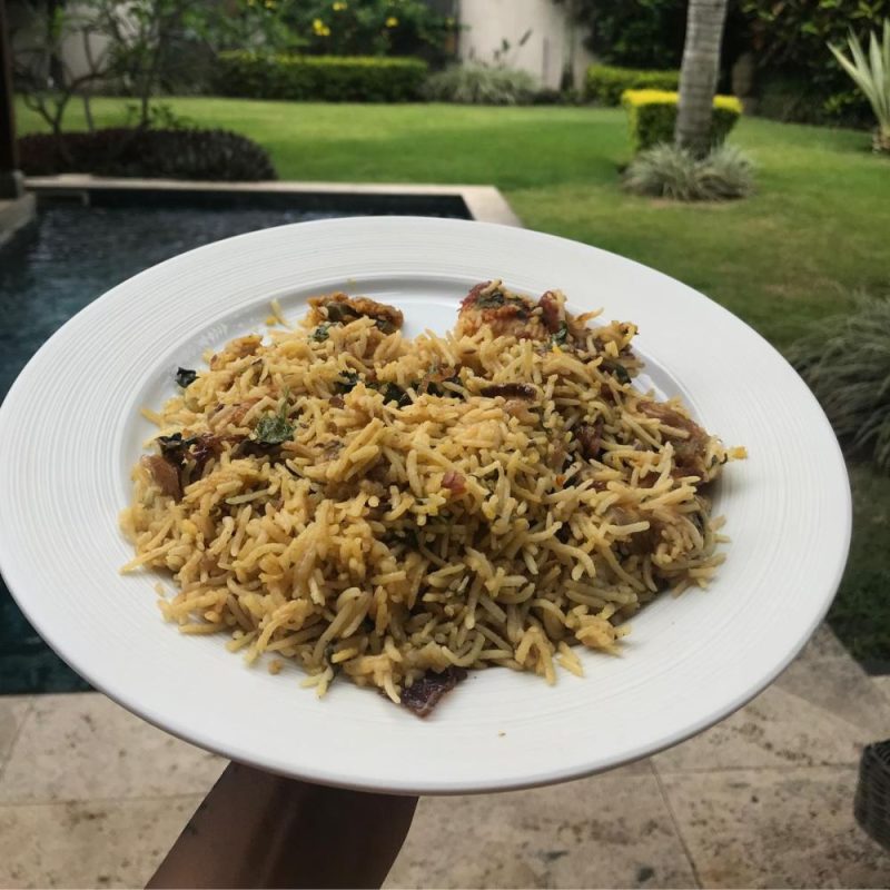 Vegetable BIryani plate of rice with vegetables in a heart shape