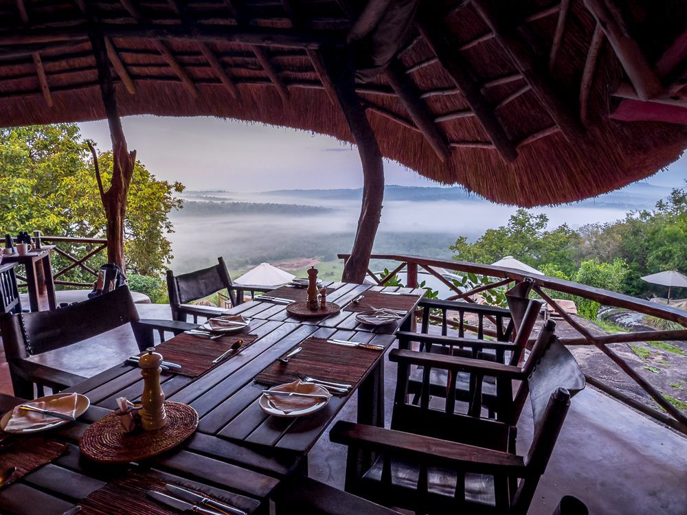 Luxury Stay At Mihingo Lodge, Lake Mburo, Uganda 20 Table set for dinner with stunning views over the misty valley