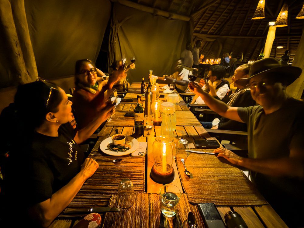 Luxury Stay At Mihingo Lodge, Lake Mburo, Uganda 21 table of people dining and raising their glasses