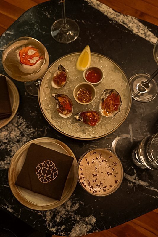 Cocktails and oysters on a table