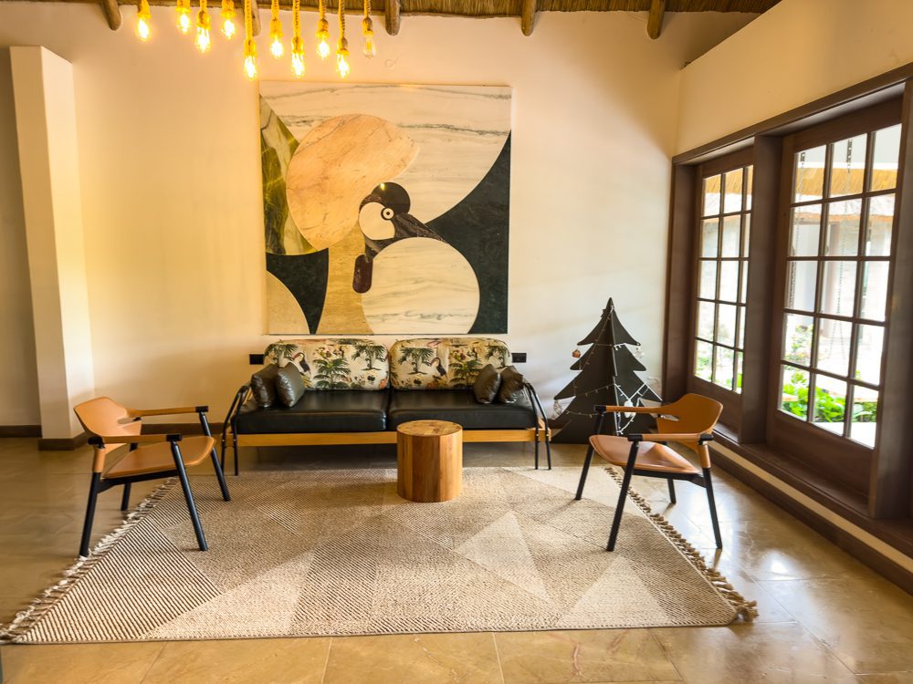 the reception area with a large abstract painting of a crested crane