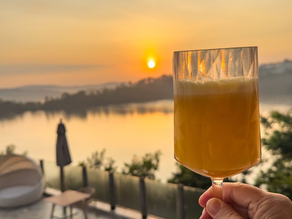 enjoying a glass of freshly squeezed orange juice as the sun comes up at Tabebuia Safari Resort