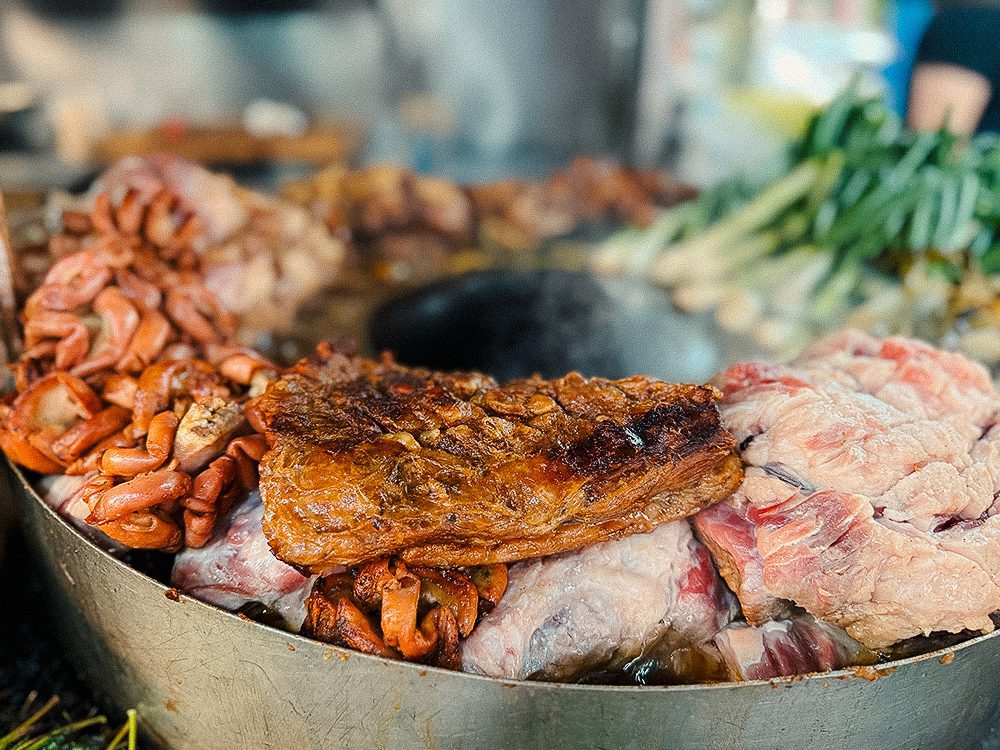 Variety of meats cooking together
